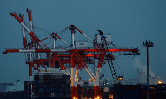 A cargo ship and containers are seen at an industrial port in Tokyo, Japan, on Feb. 15, 2022. (Kim Kyung-Hoon/Reuters)