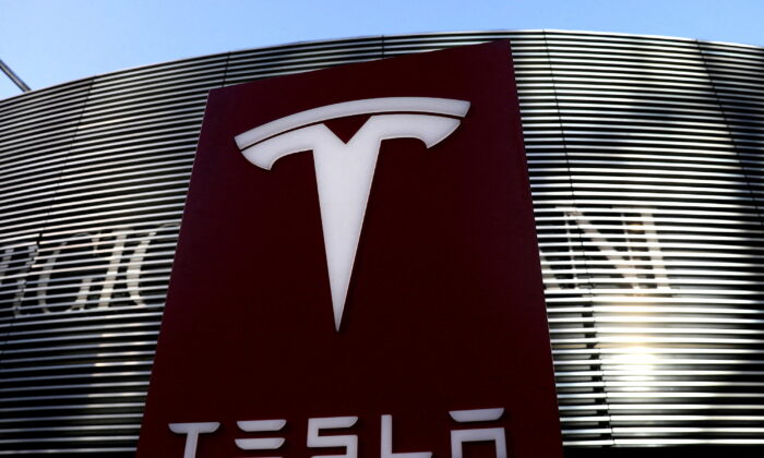 A logo of the electric vehicle maker Tesla is seen near a shopping complex in Beijing, on Jan. 5, 2021. (Tingshu Wang/Reuters)
