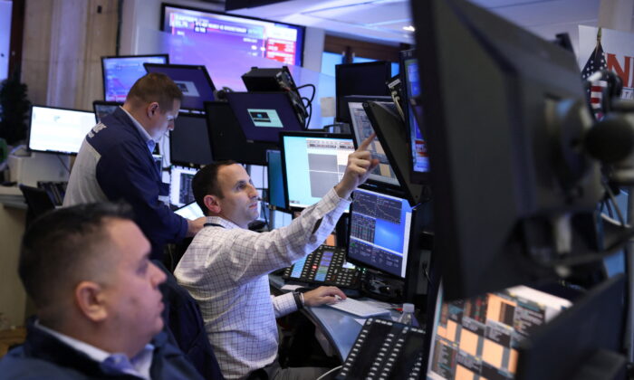 Traders work on the trading floor at the New York Stock Exchange (NYSE) in New York, on March 7, 2022. (Andrew Kelly/Reuters)