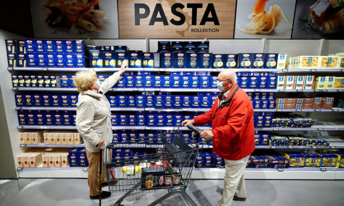 Customers at the Edeka grocery store buy pasta, as the spread of COVID-19 continues in Duesseldorf, Germany, on April 29, 2020. (Wolfgang Rattay/Reuters)