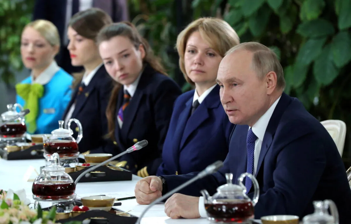 Russian President Vladimir Putin attends a meeting with flight personnel, students, and employees of the Aeroflot Aviation School on the suburbs of Moscow, Russia, on March 5, 2022. (Sputnik/Mikhail Klimentyev/Kremlin via Reuters)