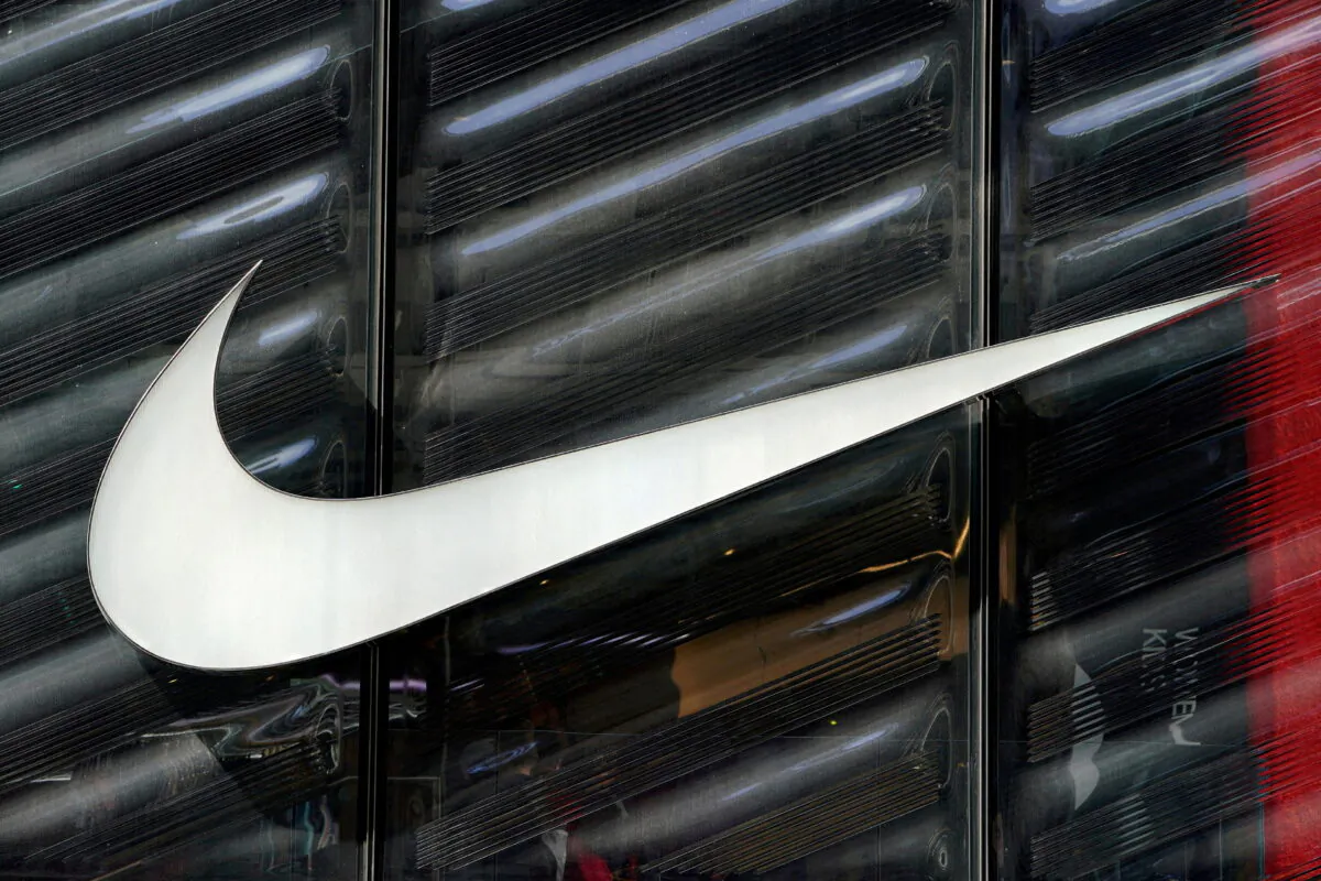 The Nike swoosh logo is seen outside the store on 5th Avenue in New York, on March 19, 2019. (Carlo Allegri/Reuters)