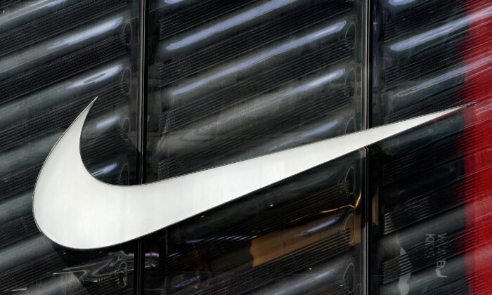 The Nike swoosh logo is seen outside the store on 5th Avenue in New York, on March 19, 2019. (Carlo Allegri/Reuters)