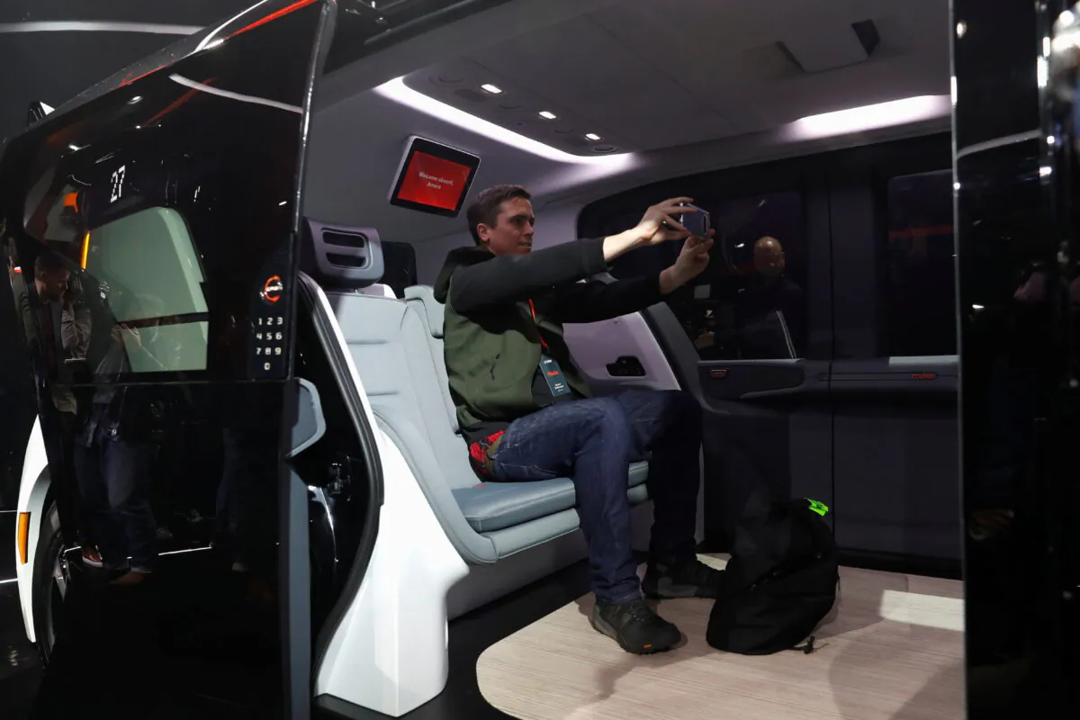 An attendee takes a selfie inside a Cruise Origin autonomous vehicle, a Honda and General Motors self-driving car partnership, during its unveiling in San Francisco, on Jan. 21, 2020. (Stephen Lam/Reuters)