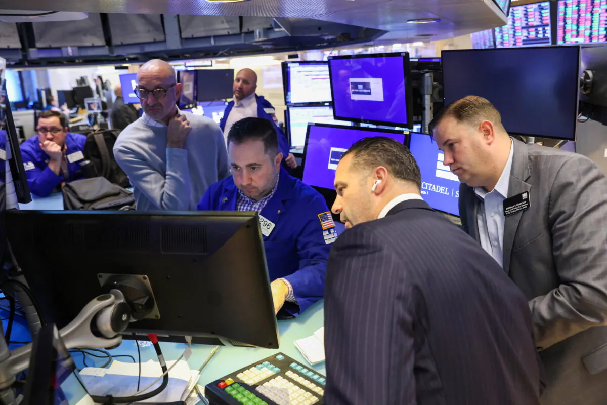 Traders work on the trading floor at the New York Stock Exchange (NYSE) in Manhattan, New York, on March 7, 2022. (Andrew Kelly/Reuters)