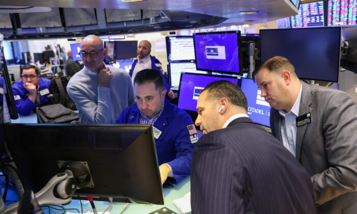Traders work on the trading floor at the New York Stock Exchange (NYSE) in Manhattan, New York, on March 7, 2022. (Andrew Kelly/Reuters)