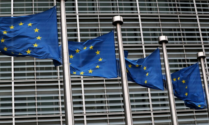 European Union flags fly outside the European Commission headquarters in Brussels, on March 6, 2019. (Yves Herman/Reuters)