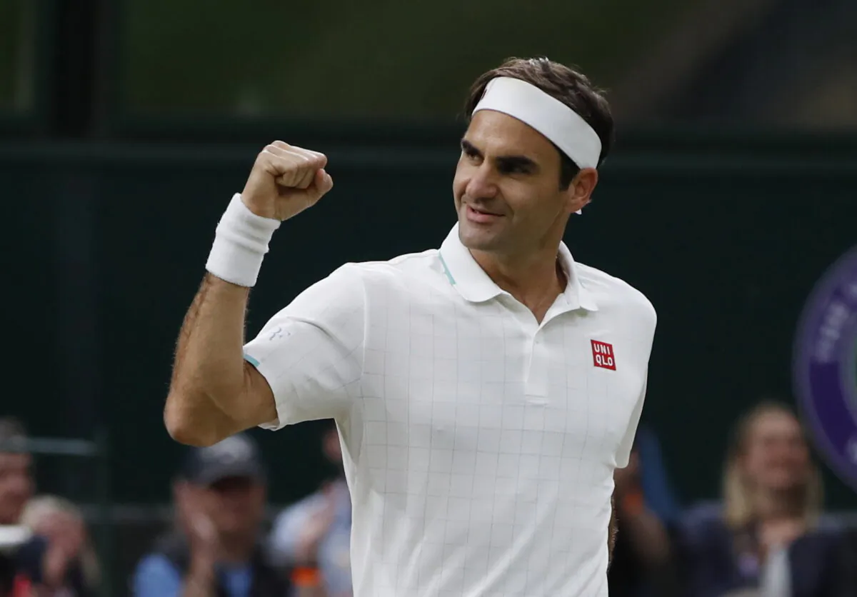Roger Federer celebrates winning his fourth round match against Italy's Lorenzo Sonego on the seventh day of the 2021 Wimbledon Championships at The All England Tennis Club in Wimbledon, southwest London, on July 5, 2021. (Paul Childs/Reuters)