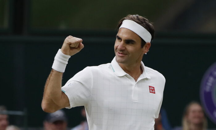 Roger Federer celebrates winning his fourth round match against Italy's Lorenzo Sonego on the seventh day of the 2021 Wimbledon Championships at The All England Tennis Club in Wimbledon, southwest London, on July 5, 2021. (Paul Childs/Reuters)