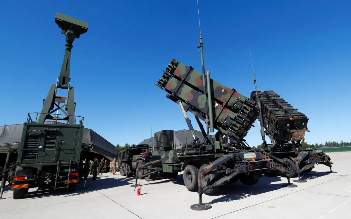 U.S. long range air defense systems Patriot (R) and British radar Giraffe AMB are displayed during Toburq Legacy 2017 air defence exercise in the military airfield near Siauliai, Lithuania, on July 20, 2017. (Ints Kalnins/Reuters)