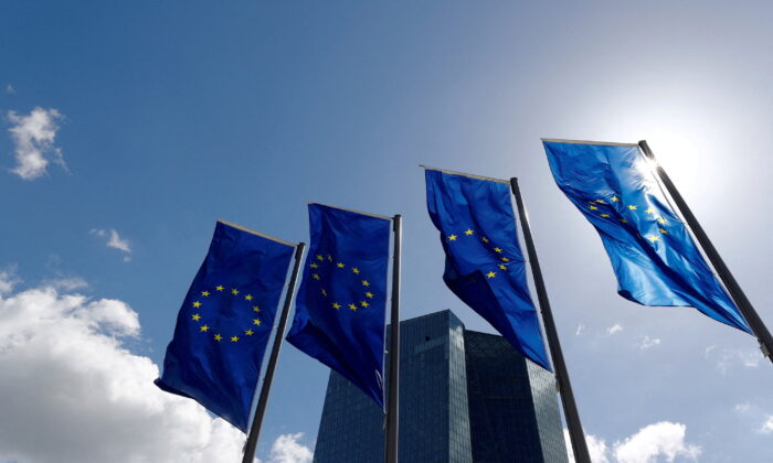 European Union flags flutter outside the European Central Bank headquarters in Frankfurt, Germany, on April 26, 2018. (Kai Pfaffenbach/Reuters)