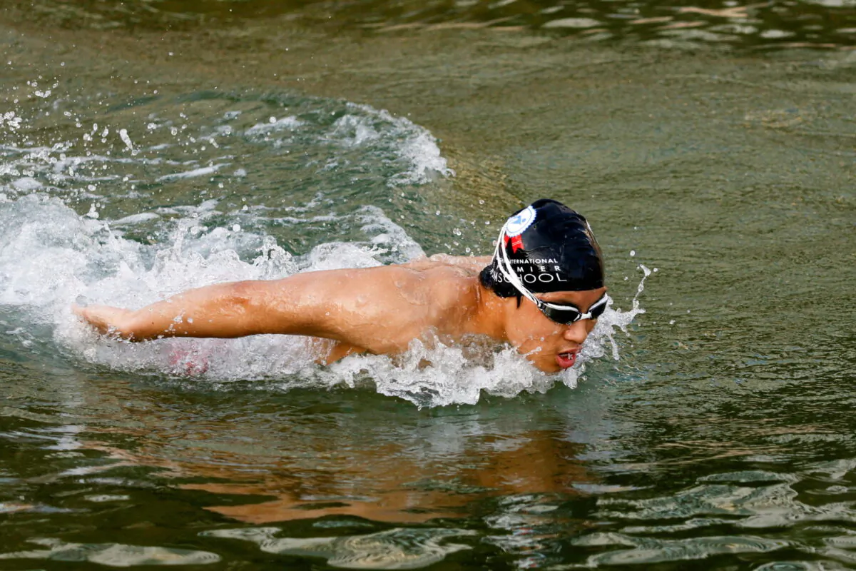 Competitive swimmer Jody Lee, 15, practices at Repulse Bay, in Hong Kong, on March 11, 2022. (Tyrone Siu/Reuters)