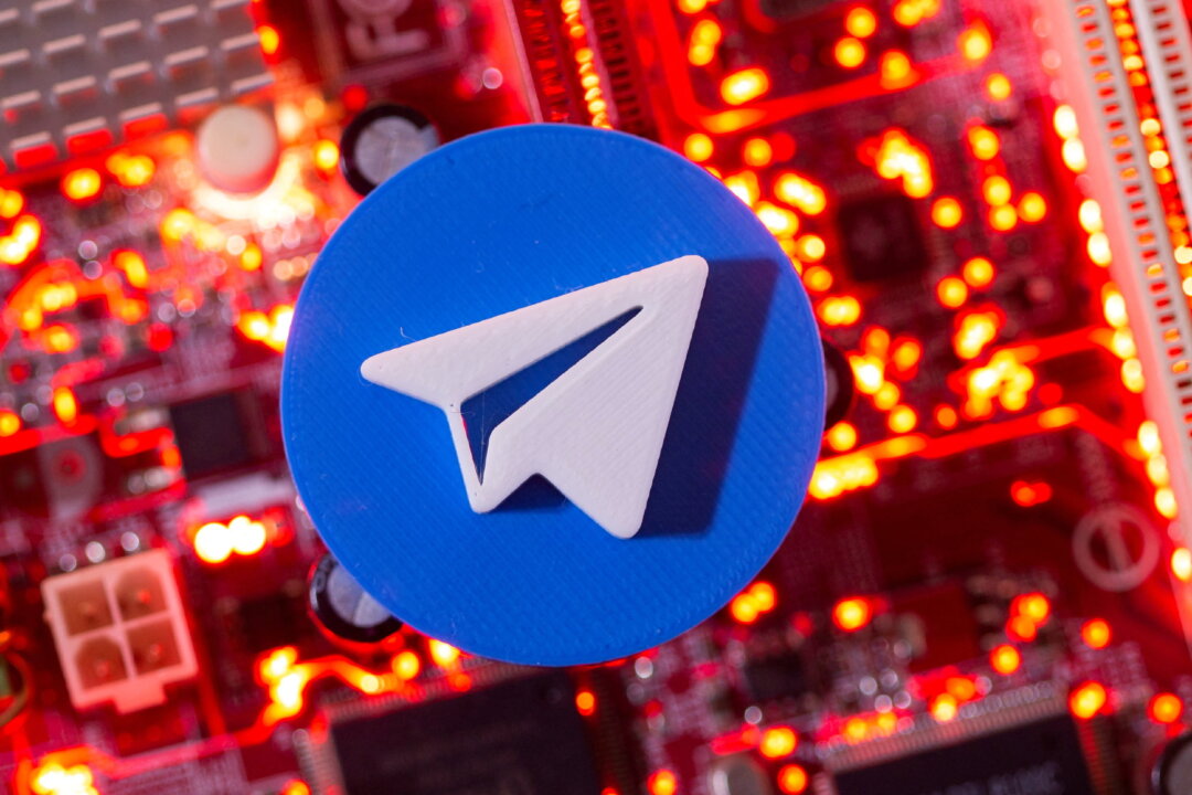 A 3D-printed Telegram logo is placed on a computer motherboard in this illustration taken on Jan. 21, 2021. (Dado Ruvic/Reuters)