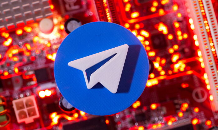 A 3D-printed Telegram logo is placed on a computer motherboard in this illustration taken on Jan. 21, 2021. (Dado Ruvic/Reuters)