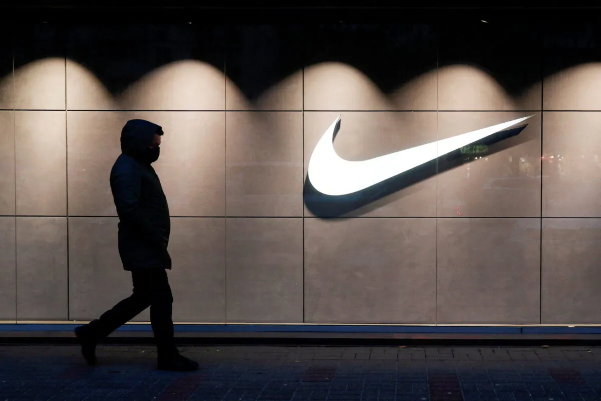 A man walks past a Nike brand store in Kyiv, Ukraine, on Dec. 10, 2020. (Valentyn Ogirenko/Reuters)