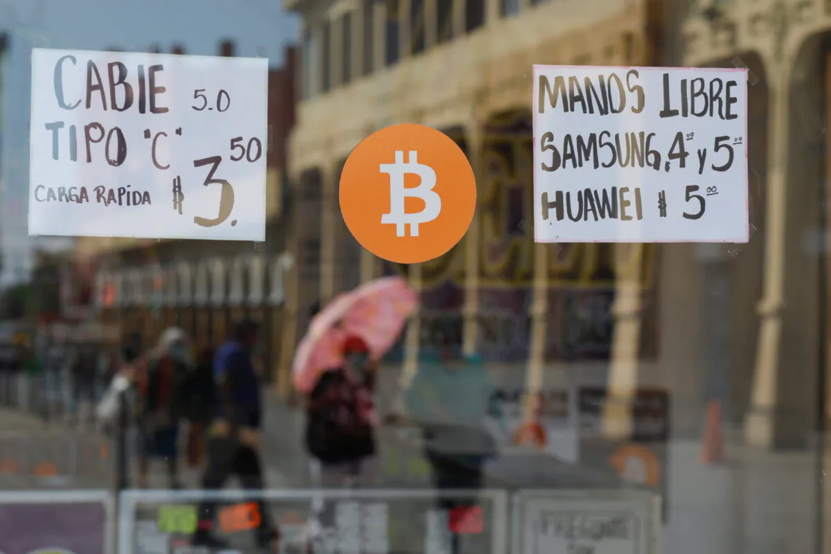 A Bitcoin sign is displayed outside a store where the cryptocurrency is accepted as a payment method in San Salvador, El Salvador, on Feb. 1, 2022. (Jose Cabezas/Reuters)