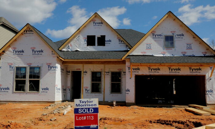 A home under construction stands behind a "sold" sign in a new development in York County, S.C., on Feb. 29, 2020. (Lucas Jackson/Reuters)
