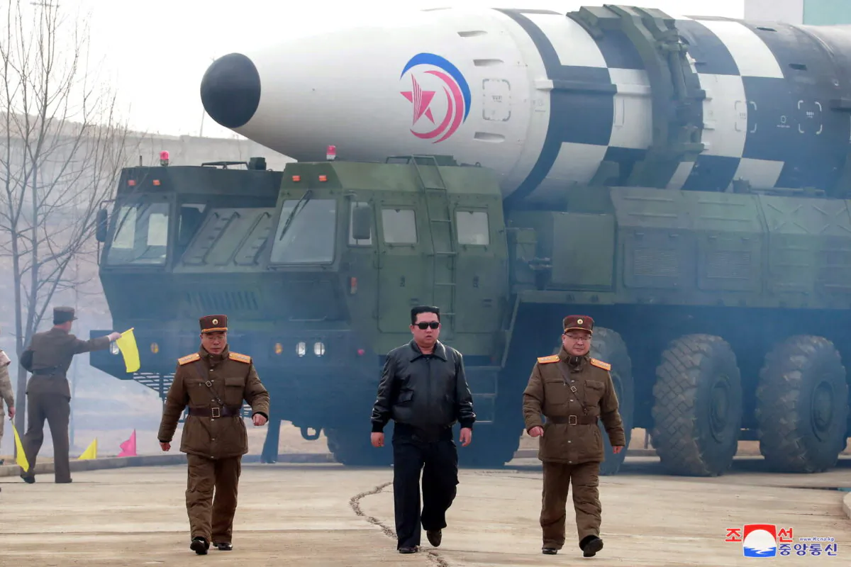 North Korean leader Kim Jong Un walks away from what state media report is a "new type" of intercontinental ballistic missile in this undated photo released on March 24, 2022 by North Korea's Korean Central News Agency (KCNA). (KCNA via Reuters)