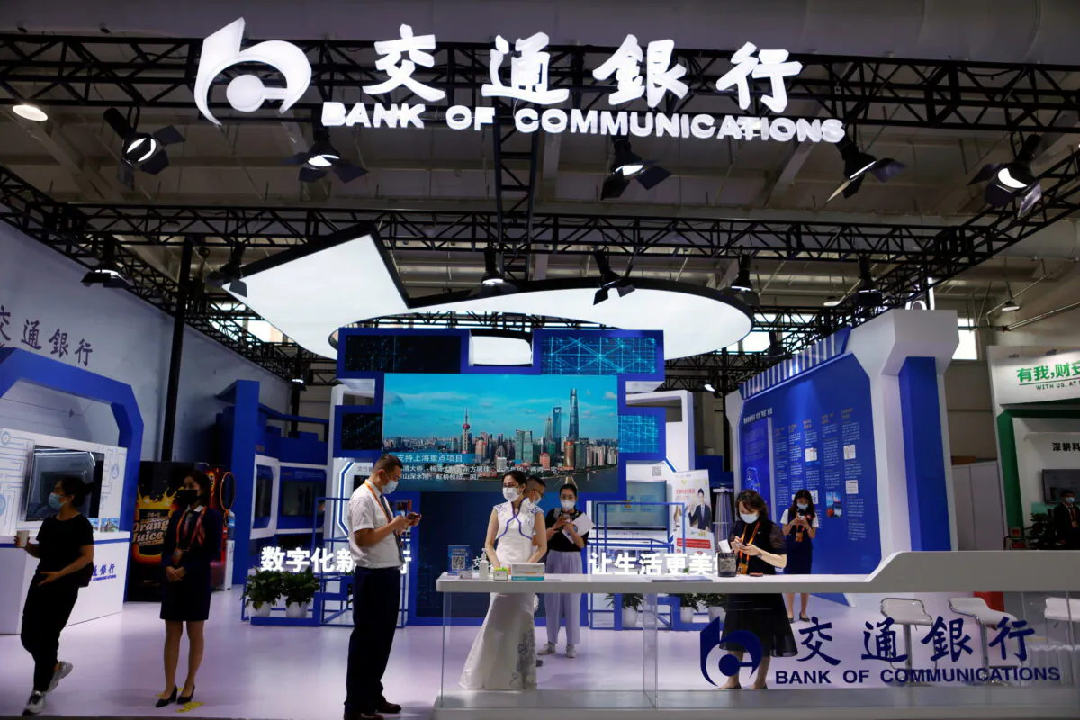 People visit the Bank of Communications' booth at the 2021 China International Fair for Trade in Services in Beijing, on Sept. 3, 2021. (Florence Lo/Reuters)