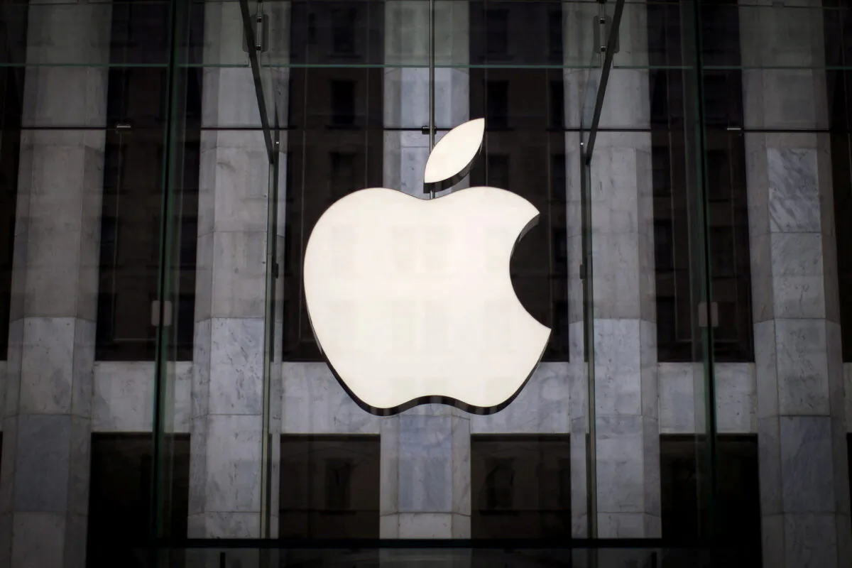 An Apple logo hangs above the entrance to the Apple store on 5th Avenue in the Manhattan borough of New York, on July 21, 2015. (Mike Segar/Reuters)