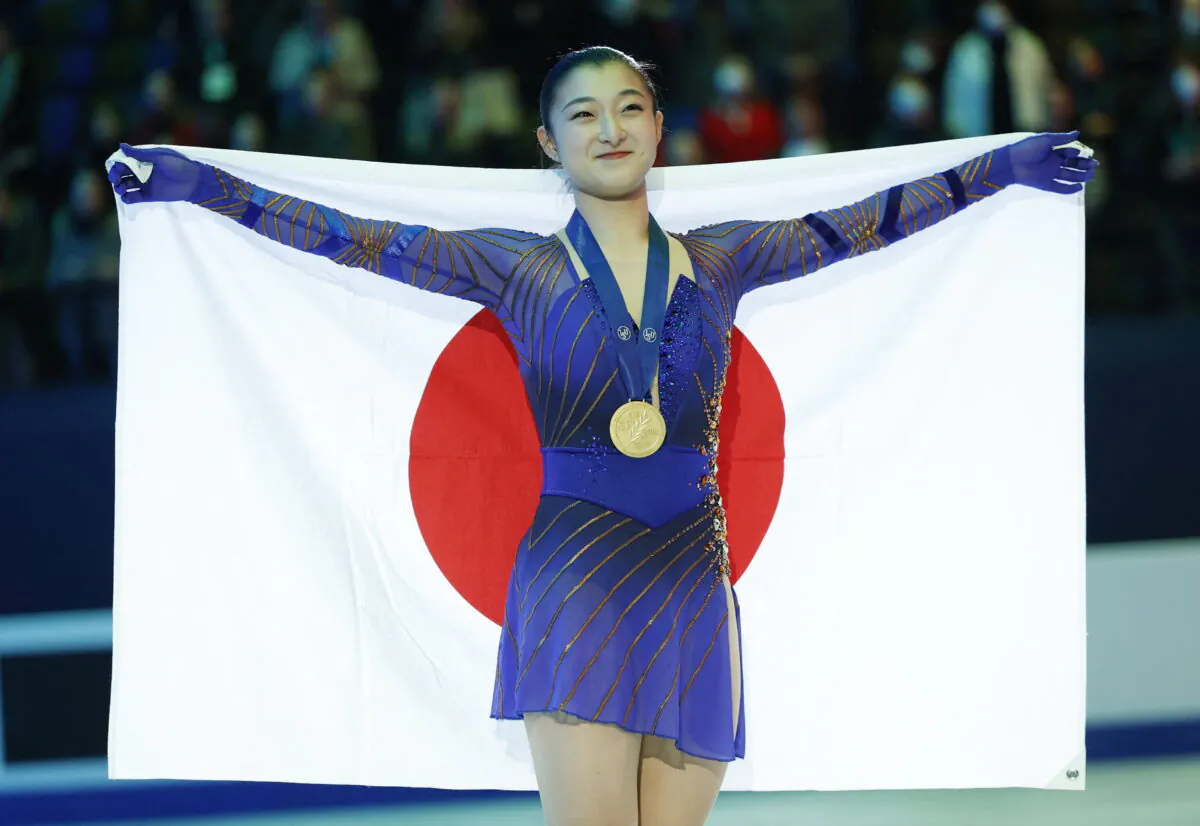 Japan's Kaori Sakamoto celebrates winning the women's free skating with her gold medal at the World Figure Skating Championships in Montpellier, France, on March 25, 2022. (Juan Medina/Reuters)
