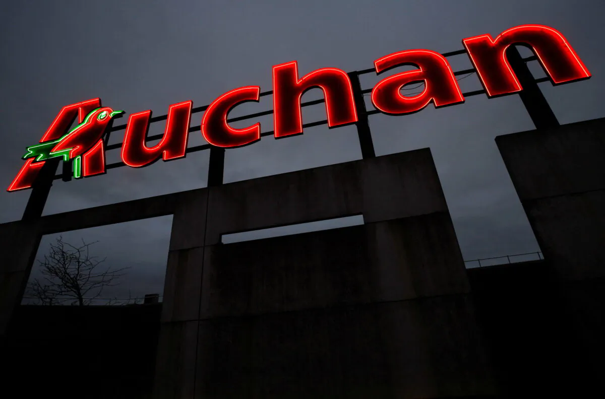 FILE PHOTO: The logo of Auchan supermarket is pictured in Saint-Sebastien-sur-Loire near Nantes, France, February 1, 2022. REUTERS/Stephane Mahe/File Photo