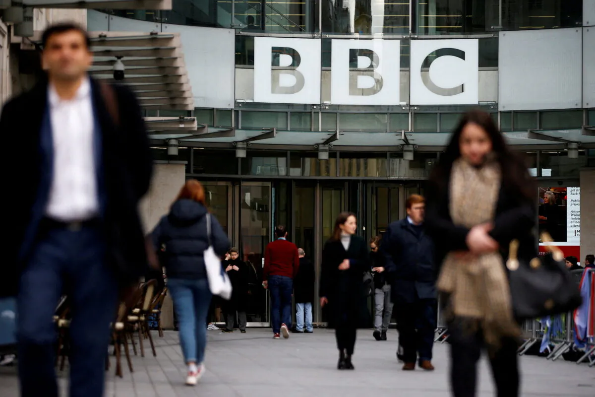 Pedestrians walk past a BBC logo at Broadcasting House in London, Jan. 29, 2020. (Henry Nicholls/File Photo/Reuters)