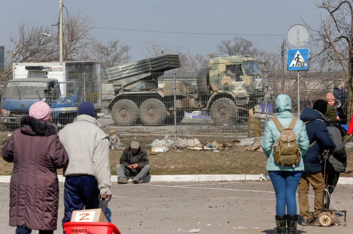 Service members of pro-Russian troops drive a multiple rocket launcher with the symbols "Z" painted on its sides in the course of Ukraine-Russia conflict in the besieged southern port city of Mariupol, Ukraine, March 24, 2022. (Alexander Ermochenko/File Photo/Reuters)