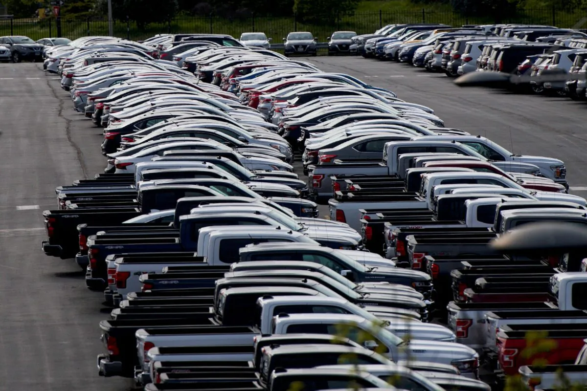 Unsold cars are stored in the parking lot of the Wells Fargo Center in Philadelphia on April 28, 2020. (Mark Makela/Reuters)