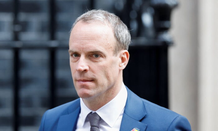 British Deputy Prime Minister and Justice Secretary Dominic Raab walks outside Downing Street, in London on March 23, 2022. (Peter Cziborra/Reuters)