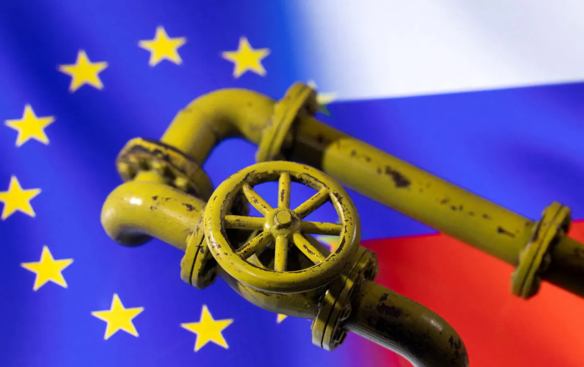 Natural gas pipes built with a 3D printer are displayed over Russian and European Union flags in this illustration taken Jan. 31, 2022. REUTERS/Dado Ruvic
