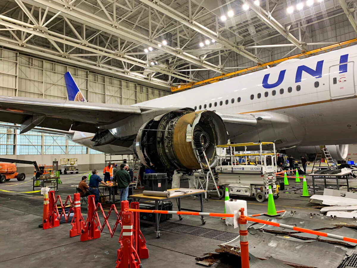 The damaged starboard engine of United Airlines flight 328, a Boeing 777-200, is seen following a February 20 engine failure incident, in a hangar at Denver International Airport in Denver, Colorado, U.S. February 22, 2021. National Transportation Safety Board/Handout via REUTERS. THIS IMAGE HAS BEEN SUPPLIED BY A THIRD PARTY. MANDATORY CREDIT