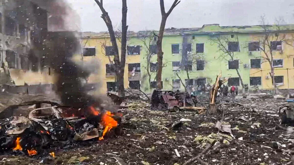 Cars and a building of a hospital destroyed by an aviation strike amid Russia's invasion of Ukraine, in Mariupol, Ukraine, in this handout picture released on March 9, 2022. (Press service of the National Police of Ukraine/Handout via Reuters)