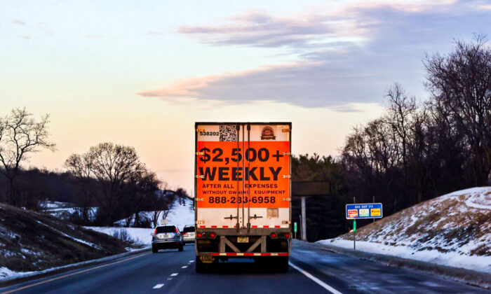 A tractor trailer advertising job opportunities in the trucking industry drives south on Interstate 81 near Staunton, Virginia, on Jan. 22, 2022. (Evelyn Hockstein/Reuters)