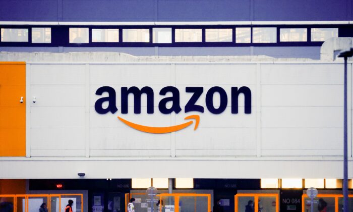 The Amazon logo is seen at the company's logistics center in Bretigny-sur-Orge, near Paris on Dec. 7, 2021. (Gonzalo Fuentes/Reuters)