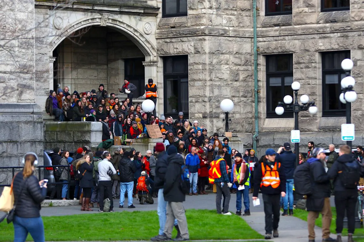 Protesters against the Coastal GasLink pipeline block an entrance to the B.C. legislature in Victoria before the throne speech on Feb. 11, 2020. (The Canadian Press/Chad Hipolito)