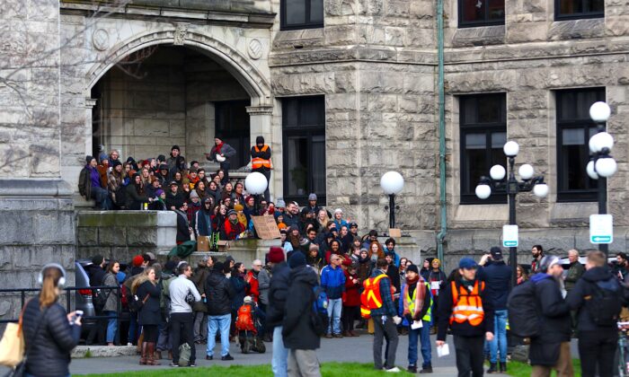 Protesters against the Coastal GasLink pipeline block an entrance to the B.C. legislature in Victoria before the throne speech on Feb. 11, 2020. (The Canadian Press/Chad Hipolito)