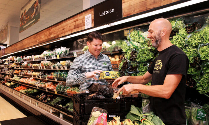 Simon Tracey, Woolworths National Community Manager meets with Wayne Pinniger during a produce contribution to OzHarvest  in Sydney, Australia, on April 22, 2020. (Lisa Maree Williams/Getty Images)