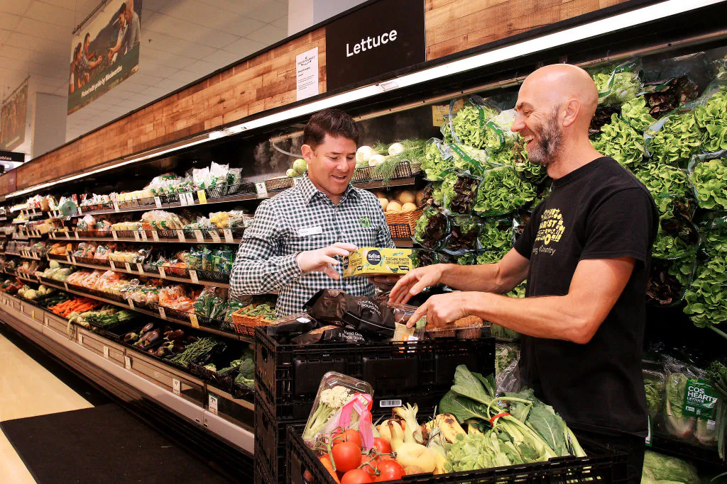 Simon Tracey, Woolworths National Community Manager meets with Wayne Pinniger during a produce contribution to OzHarvest  in Sydney, Australia, on April 22, 2020. (Lisa Maree Williams/Getty Images)