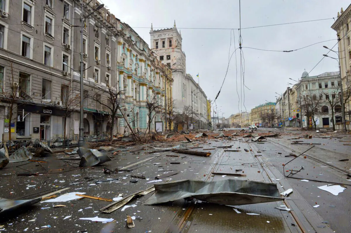 A picture shows damages after the shelling by Russian forces of Constitution Square in Kharkiv, Ukraine's second-biggest city, on March 2, 2022. (SERGEY BOBOK/AFP via Getty Images)