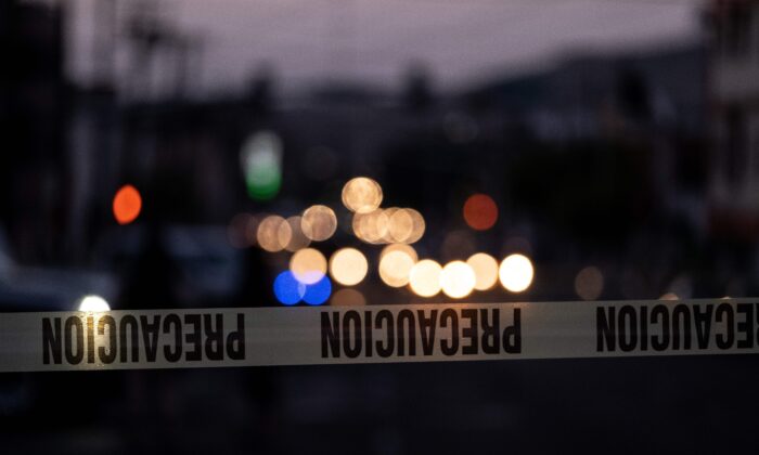 A police tape marks the perimeter of a crime scene in Mexico, on April 21, 2019. (Guillermo Arias/AFP via Getty Images)