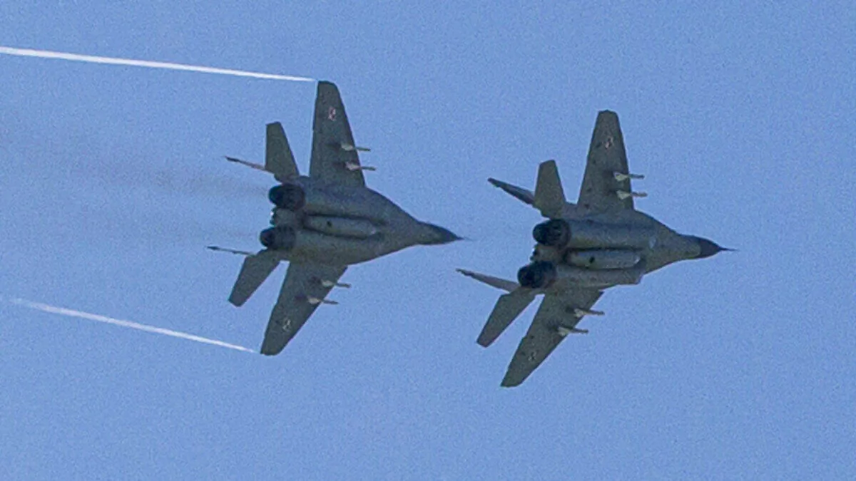 Polish MiG-29s fly over Malbork, Poland, on April 29, 2014. (Joel Saget/AFP via Getty Images)