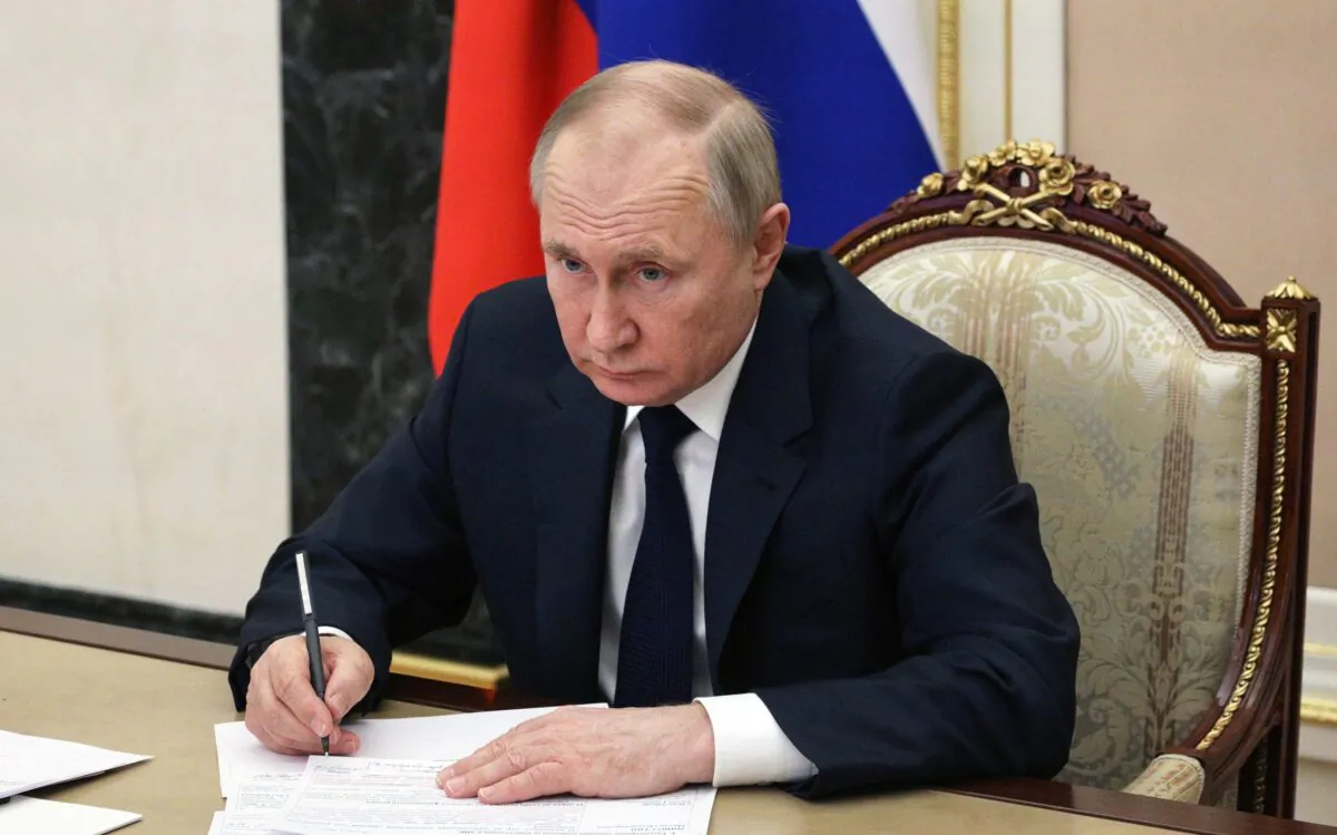 Russian President Vladimir Putin chairs a meeting with members of the Russian government in Moscow, on March 10, 2022. (Mikhail Klimentyev/Sputnik/AFP via Getty Images)