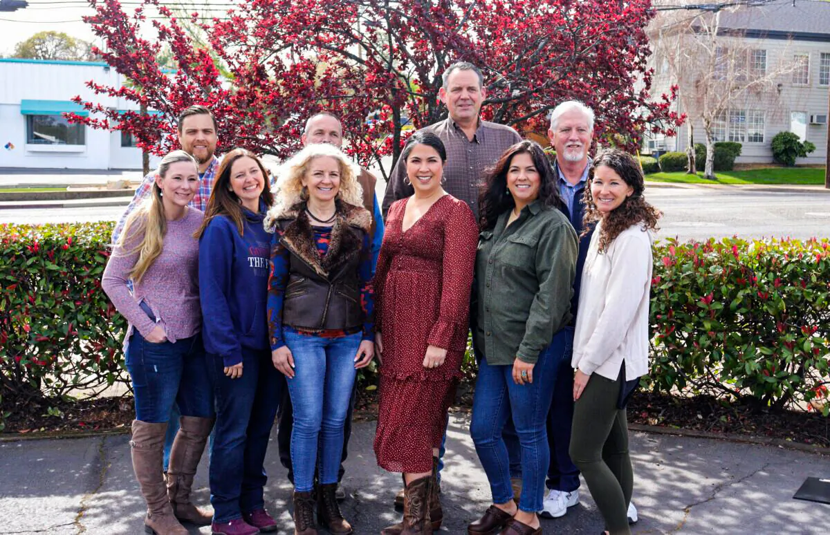 (Back, L–R) Erik Jensen, Patrick Jones, Chris Kelstrom, and Bob Holsinger; (front, L–R) Katie Gorman, Regina Sharrett, Ronnean Lund, Melody Fowler, Melissa Magaña, and Elissa McEuen in Redding, Calif., on March 5, 2022. (Cynthia Cai/The Epoch Times)