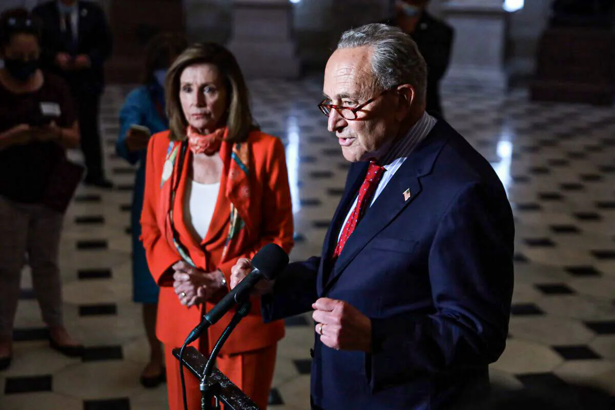 Senate Minority Leader Sen. Chuck Schumer (D-N.Y.) speaks to reporters as House Speaker Nancy Pelosi (D-Calif.) listens, at the U.S. Capitol in Washington on Aug. 4, 2020. (Alex Wong/Getty Images)