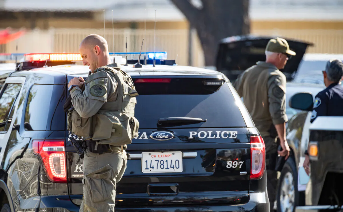 Santa Ana Police Department SWAT teams secure a scene in Santa Ana, Calif., on March 10, 2022. (John Fredricks/The Epoch Times)