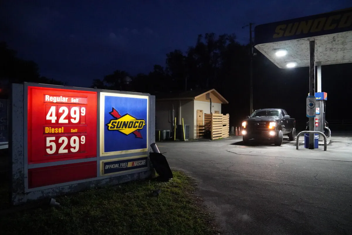 A driver pulls up to a gas pump in High Springs, Fla. on March 10, 2022. (Nanette Holt/The Epoch Times)