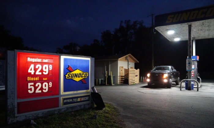 A driver pulls up to a gas pump in High Springs, Fla. on March 10, 2022. (Nanette Holt/The Epoch Times)