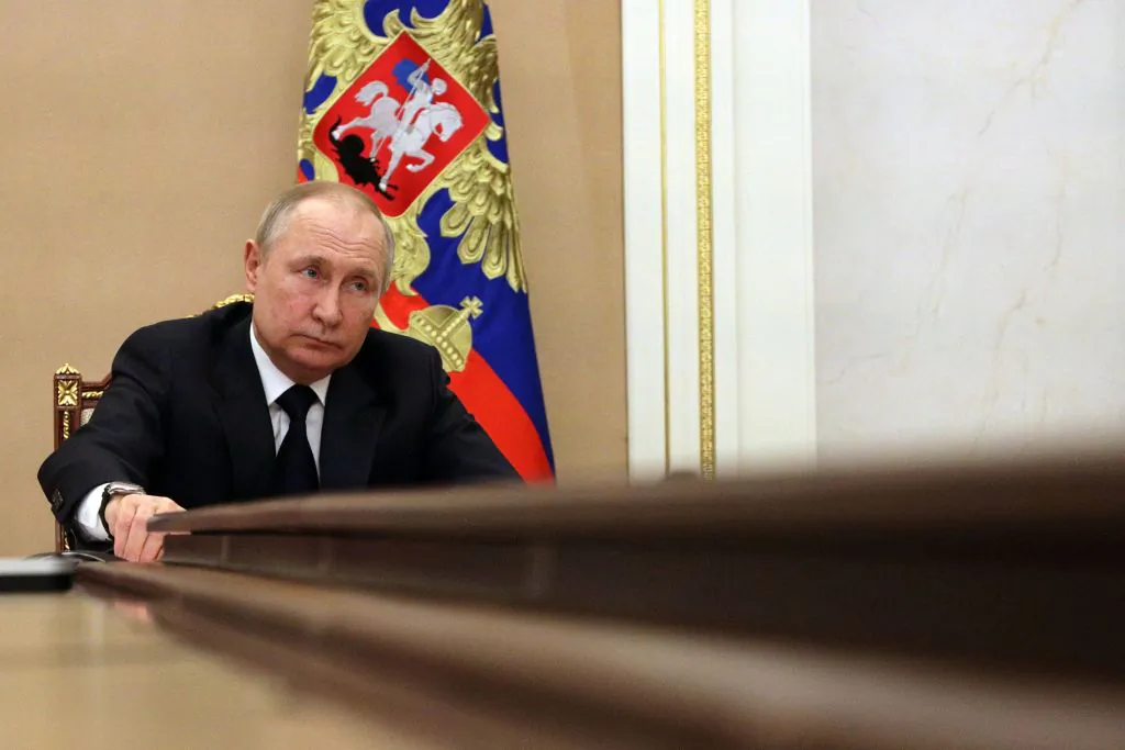 Russian President Vladimir Putin chairs a meeting with members of the Russian government via teleconference in Moscow on March 10, 2022. (Mikhail Klimentyev/Sputnik/AFP via Getty Images)