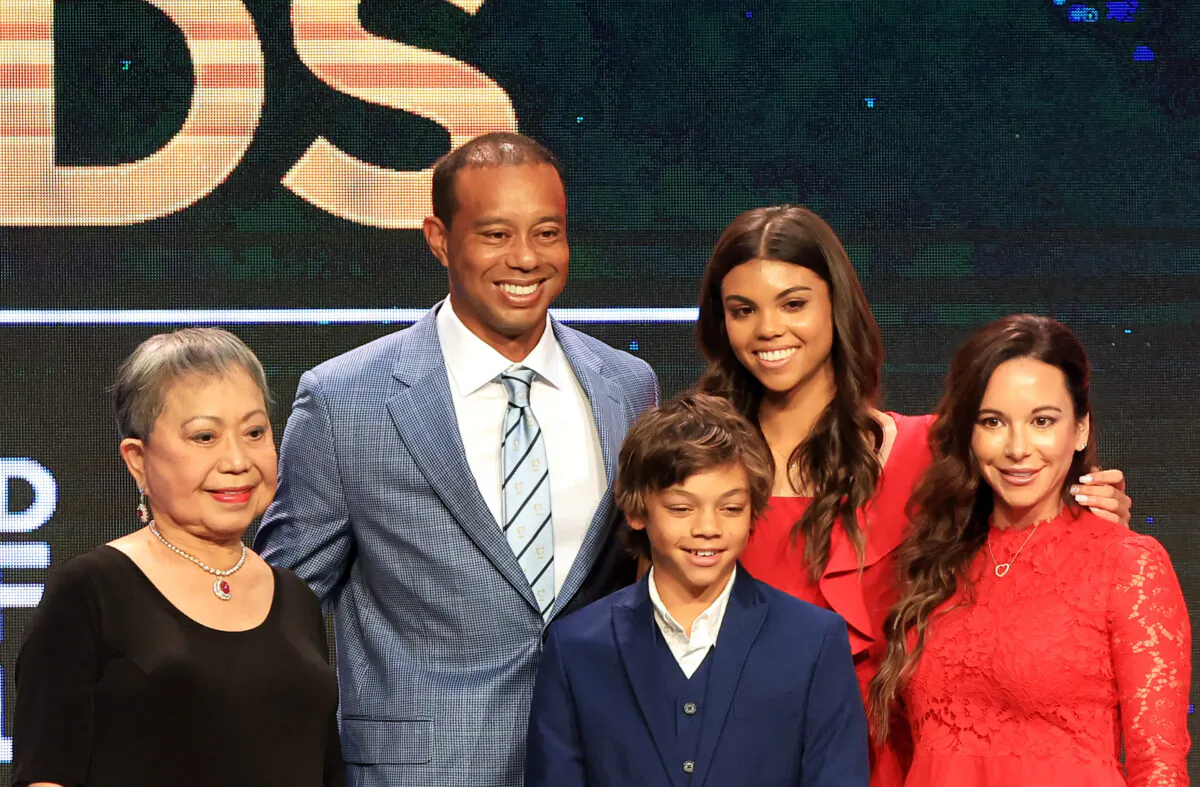 Tiger Woods, mother Kultida Woods (L), children Sam Alexis Woods and Charlie Axel Woods (C), and girlfriend Erica Herman (R) pose for a photo prior to his induction at the 2022 World Golf Hall of Fame Induction at the PGA TOUR Global Home, in Ponte Vedra Beach, Fla., on March 9, 2022. (Sam Greenwood/Getty Images)